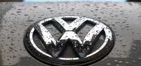 water dew on silver Volkswagen car emblem